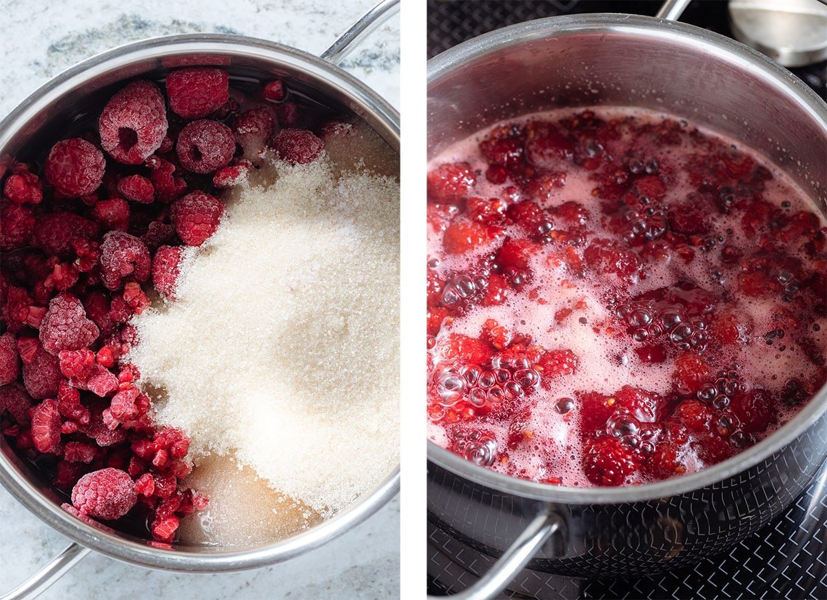 Raspberries, cane sugar, and water simmering in a small pot on the stove.