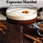 Chai espresso martini in a coupe glasses with a thick foam on top garnished with whole star anise.