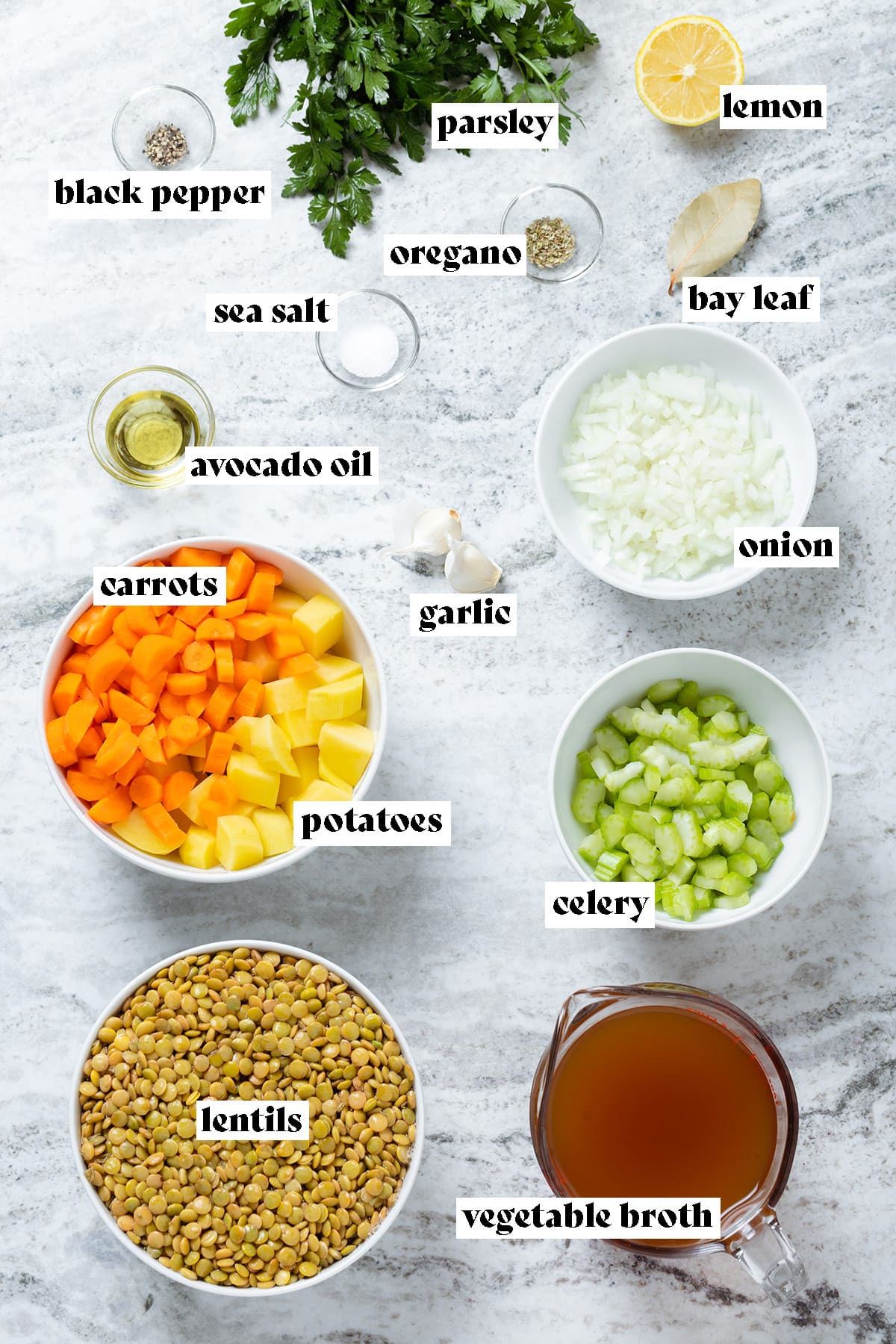 Ingredients like lentils, carrots, potatoes, and celery laid out all measured out and chopped with text overlay.
