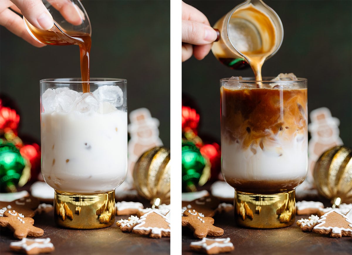 Gingerbread syrup and espresso being poured over milk and ice into a tall glass with a thick gold stem.