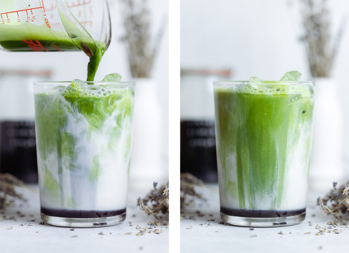 Matcha being poured over milk and ice into a tall glass.