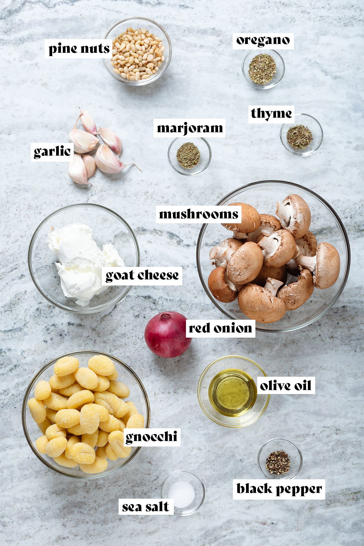 Gnocchi, mushrooms, red onion, goat cheese, spices, oil, and other ingredients all measured and laid out in small bowls with text overlay.