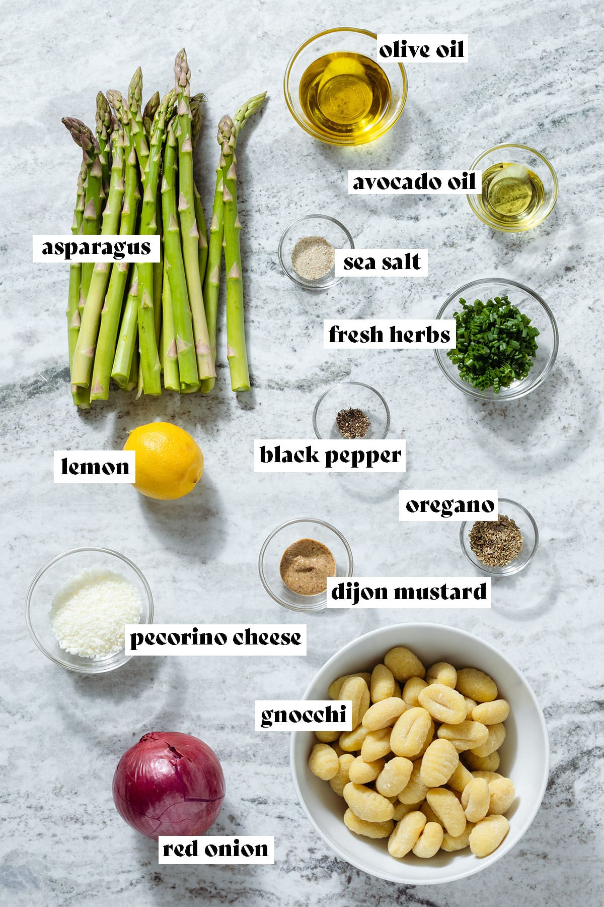 Asparagus, gnocchi, red onion, herbs, spices, and other ingredients laid out in small glass bowls with text overlay.