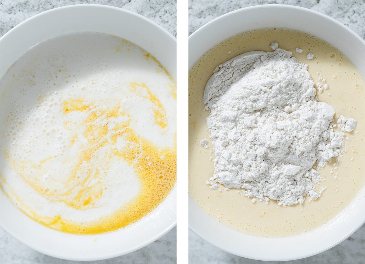 Mixing dry ingredients into wet ingredients in a large white bowl.