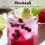 Bright purple blueberry mocktail in a short glass with ice and sparkling water on top creating a layered effect garnished with fresh lime and mint.