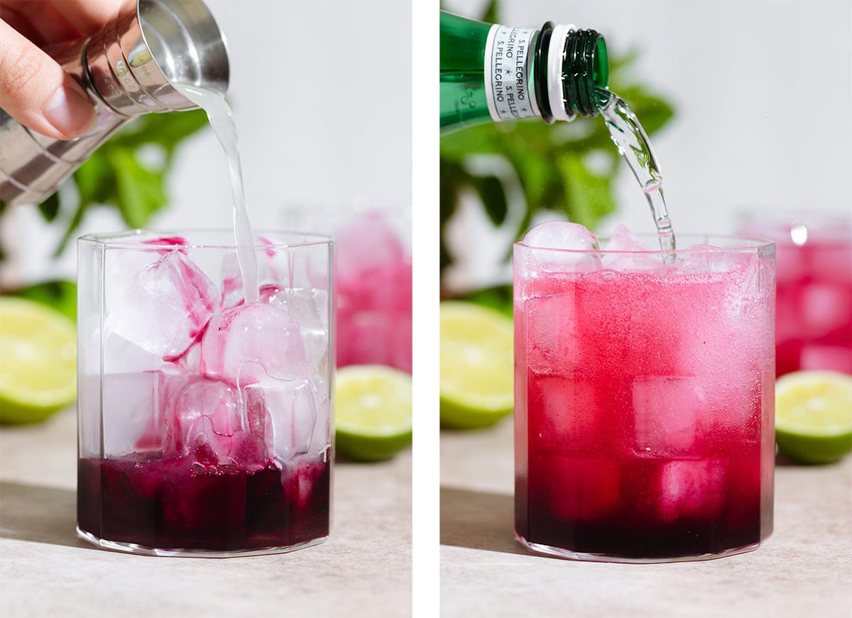 Lemon juice and sparkling water being added to a short glass with ice and blueberry syrup.