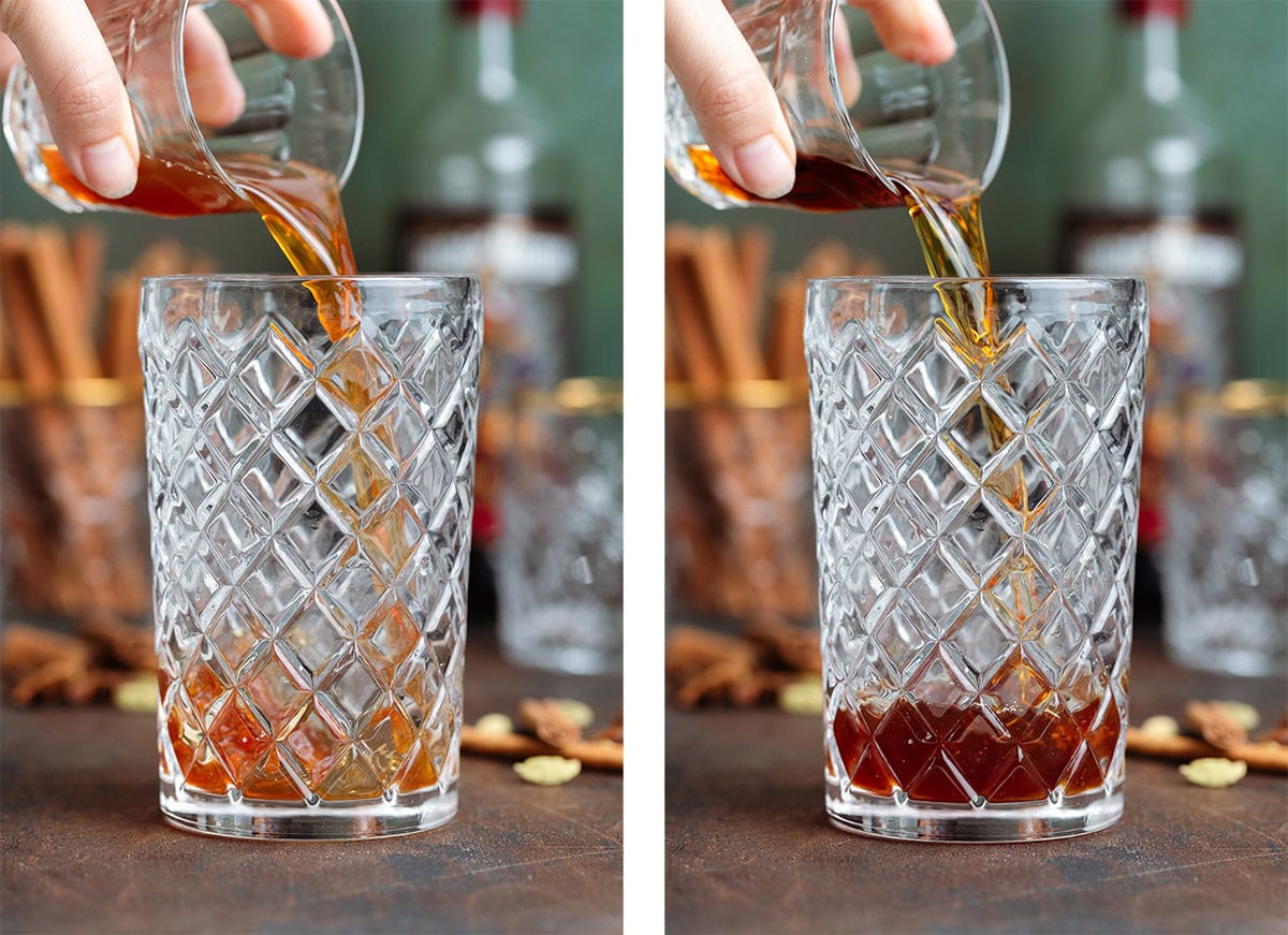 Dark rum and chai tea being poured into a glass cocktail shaker.