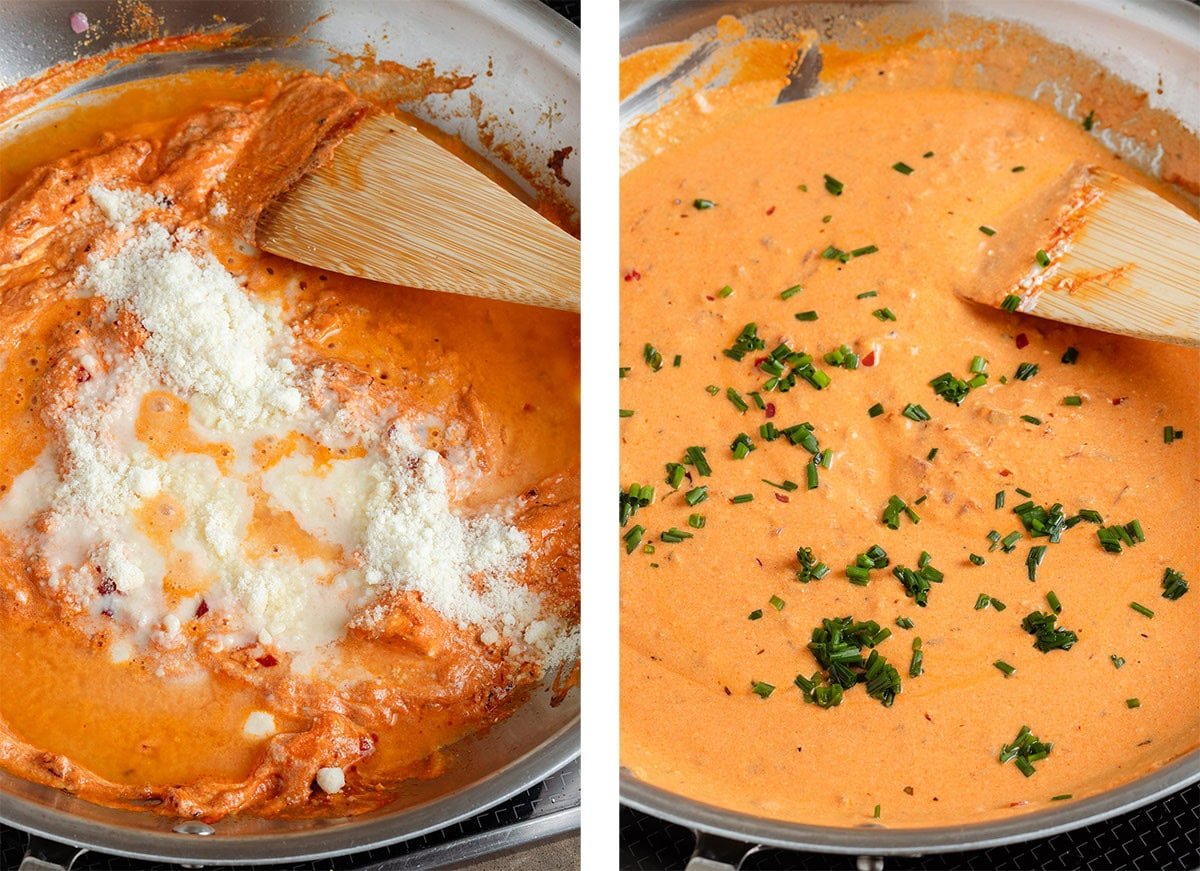 Parmesan and fresh chives being stirred into creamy red sauce in a large pan with a wooden spoon.