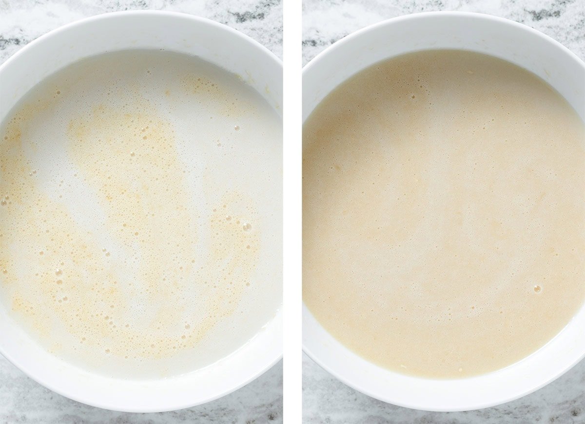 Milk being added to the rest of the whisked wet ingredients in a larger white bowl.