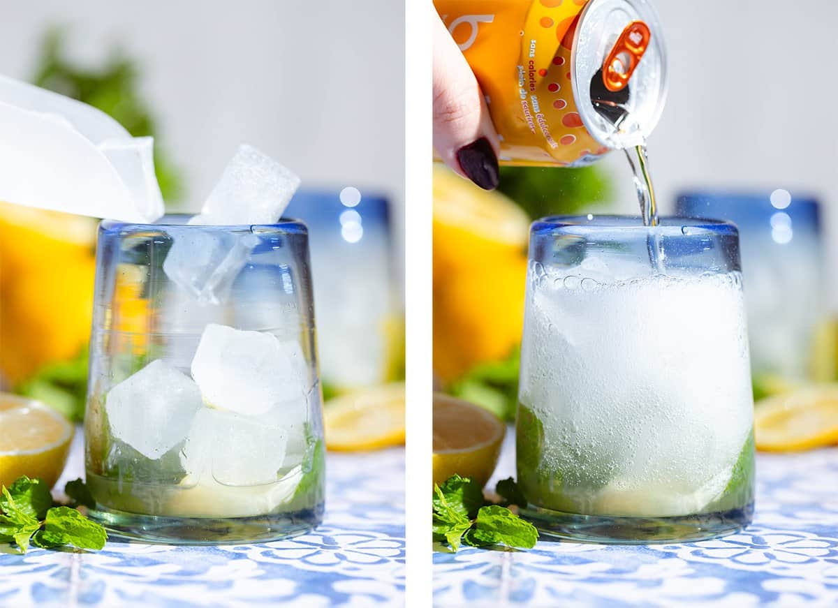 Ice being added into a short glass with lemon slices and fresh mint and topping it up with lemon soda.