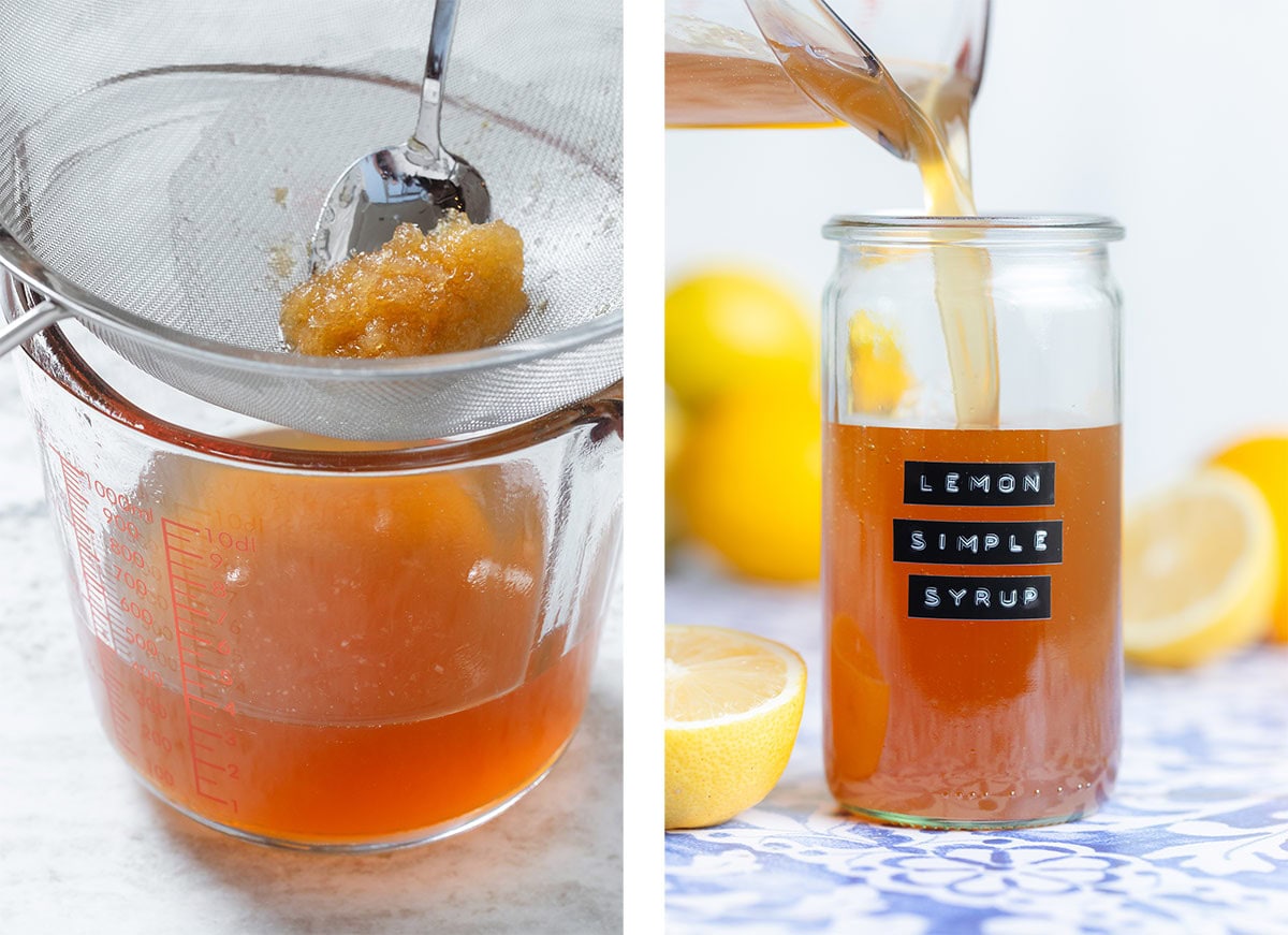 Orange colored lemon syrup being strained through a fine mesh strainer into a glass measuring cup and poured into a tall glass jar.