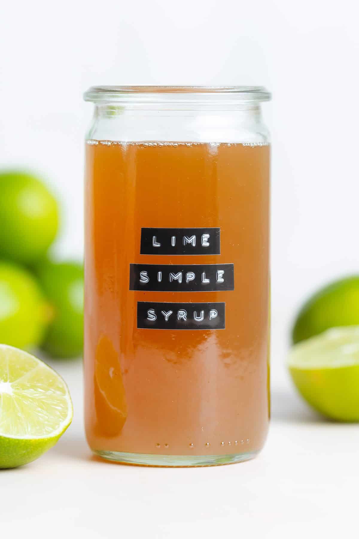 Dark yellow syrup in a glass jar without a lid.