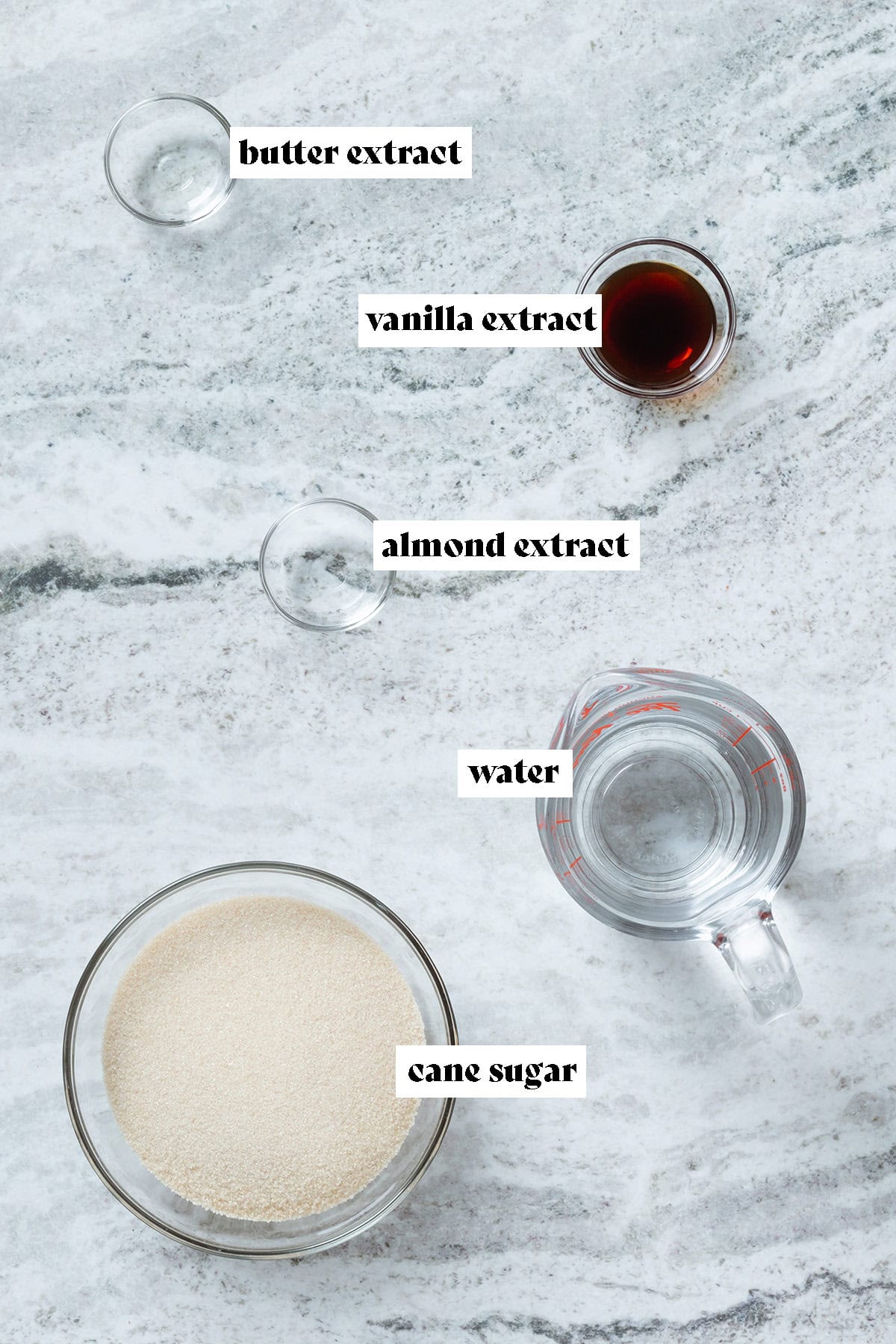 Cane sugar, water, and extracts in small glass bowls.