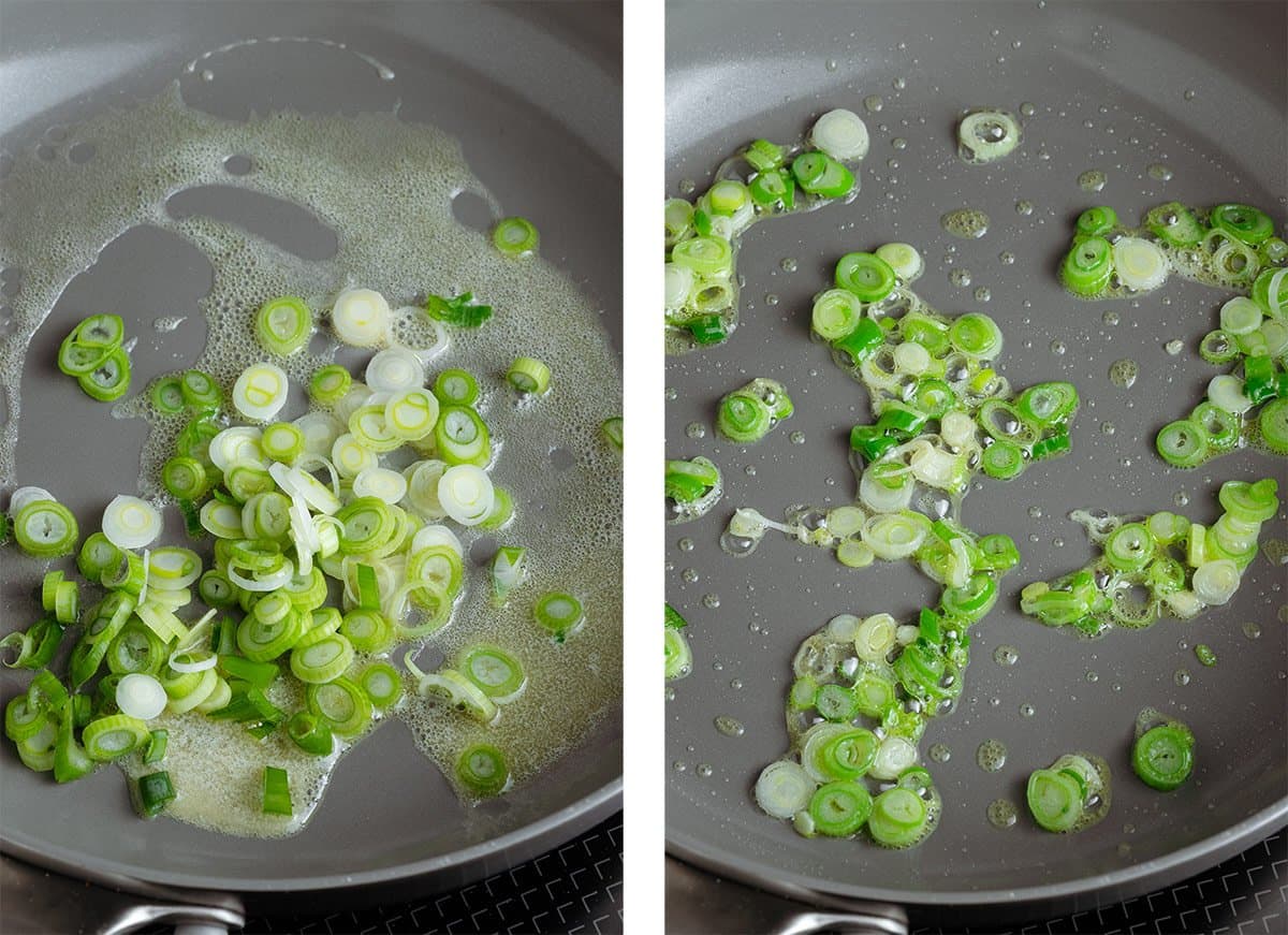 Sliced green onion cooking with butter in a non-stick pan on the stove.