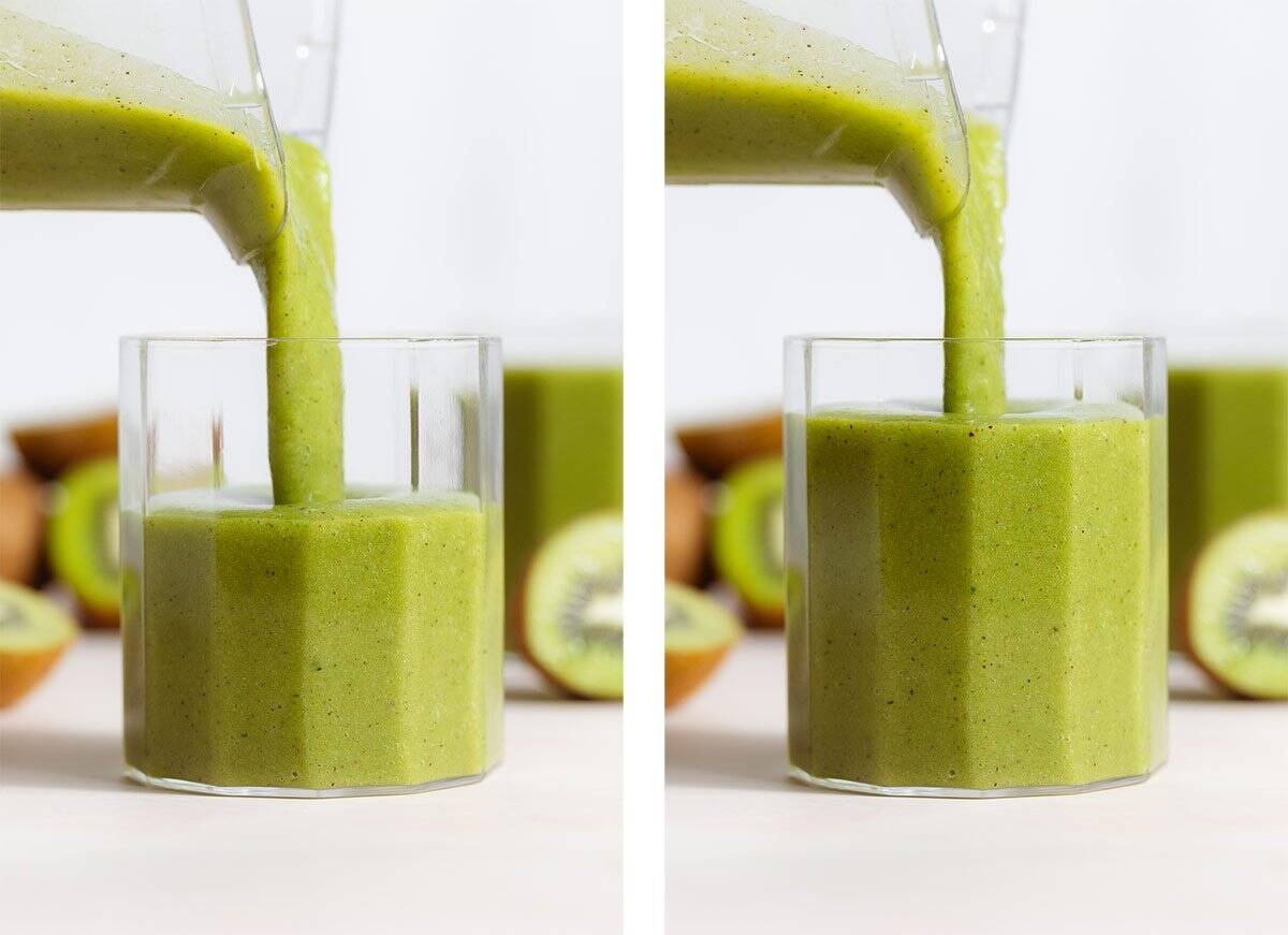 Bright green smoothie being poured into a short glass.