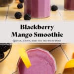 Vibrant purple smoothie in a short glass garnished with blackberries and slices of mango.