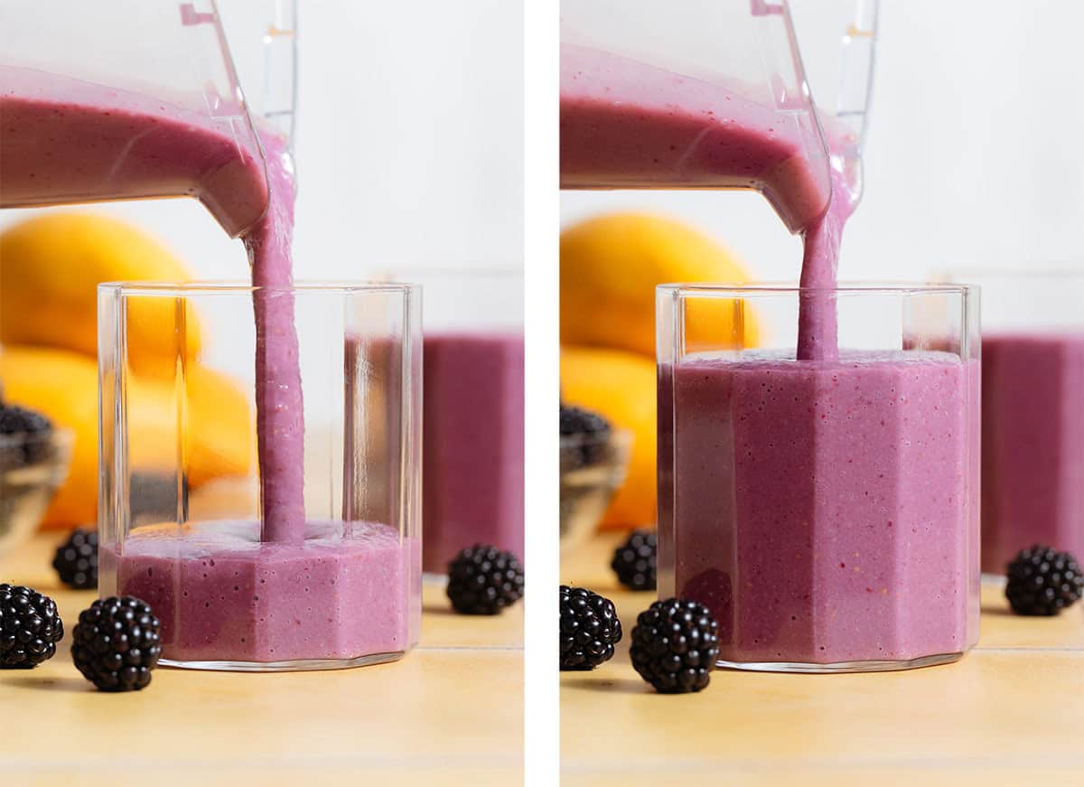 A vibrant purple smoothie being poured into a short glass.