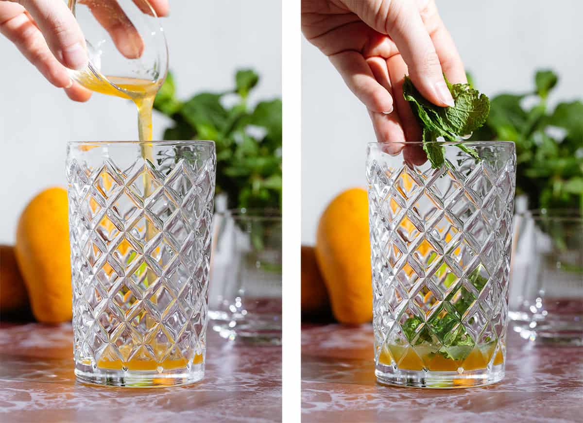 Mango syrup and fresh mint being added to a glass cocktail shaker.