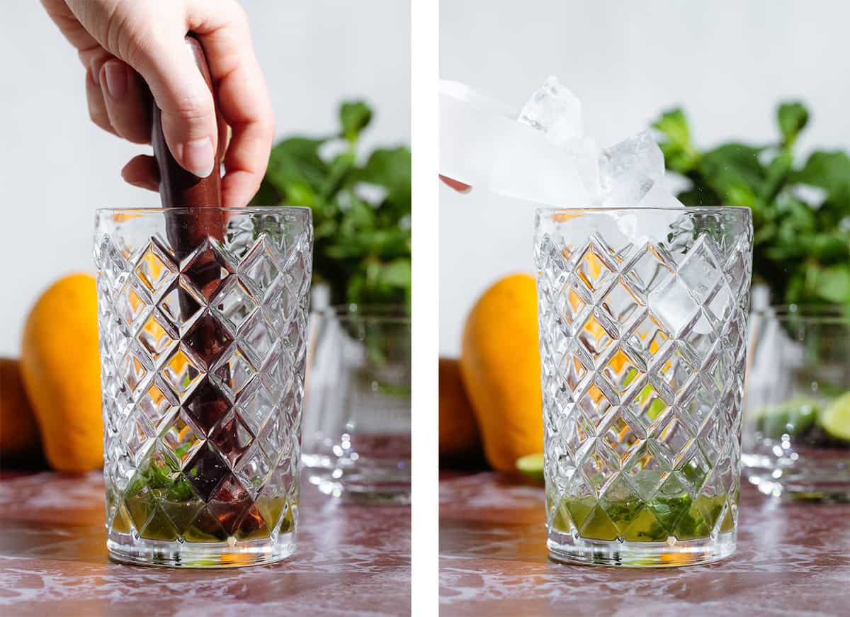 Fresh mint being muddled with a wooden muddler in a glass cocktail shaker and ice being added.