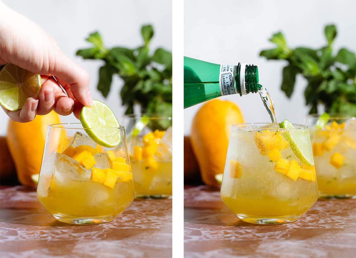 A mango drink topped with sparkling water and garnished with a slice of lime.