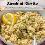 Creamy zucchini risotto garnished with fresh parsley and lemon wedges in a low bowl with a beige rim and with a fork.