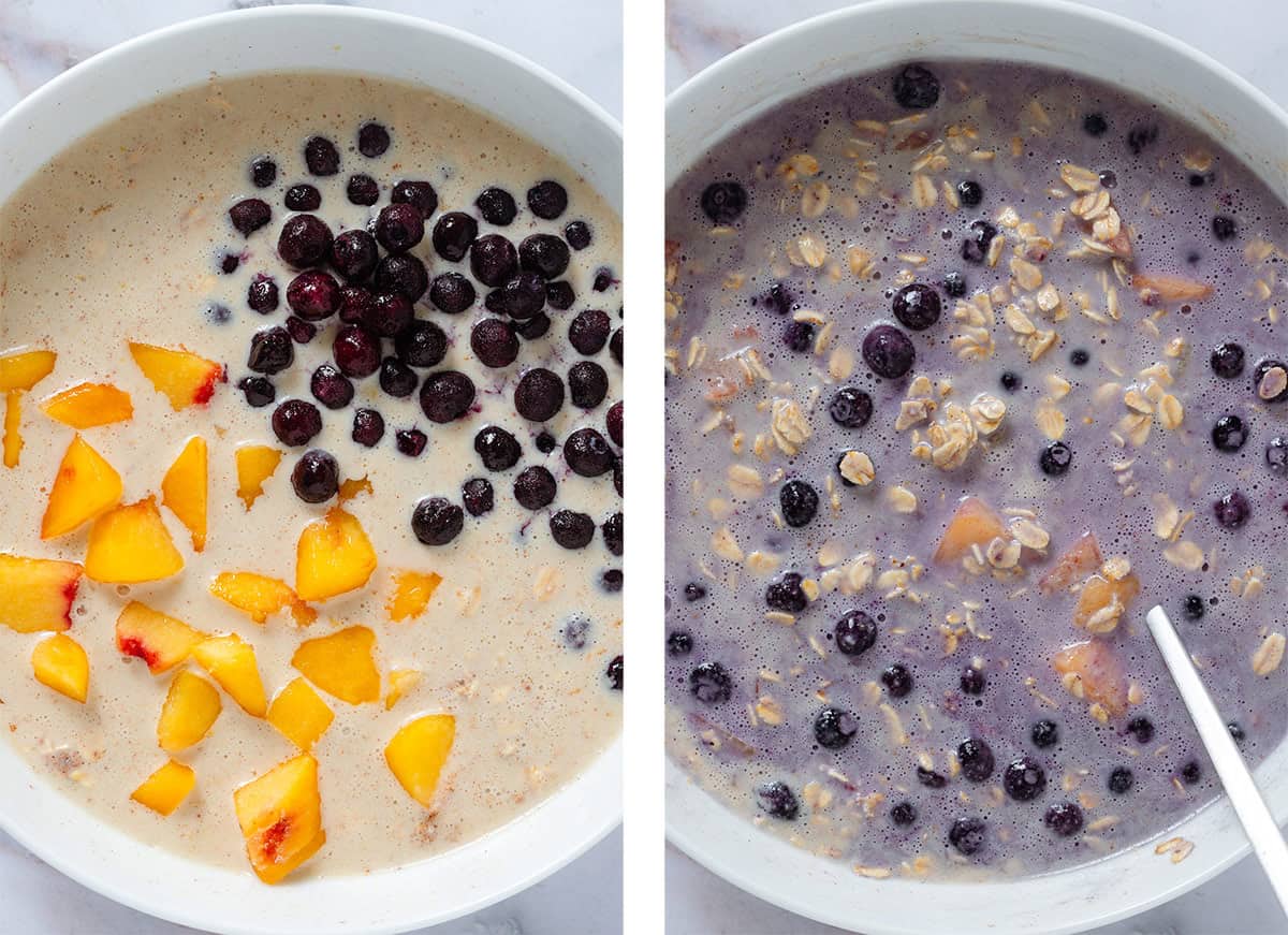 Whisked oats, milk, eggs, and other ingredients in a while bowl with added frozen blueberries and sliced peaches before and after stirring them in.