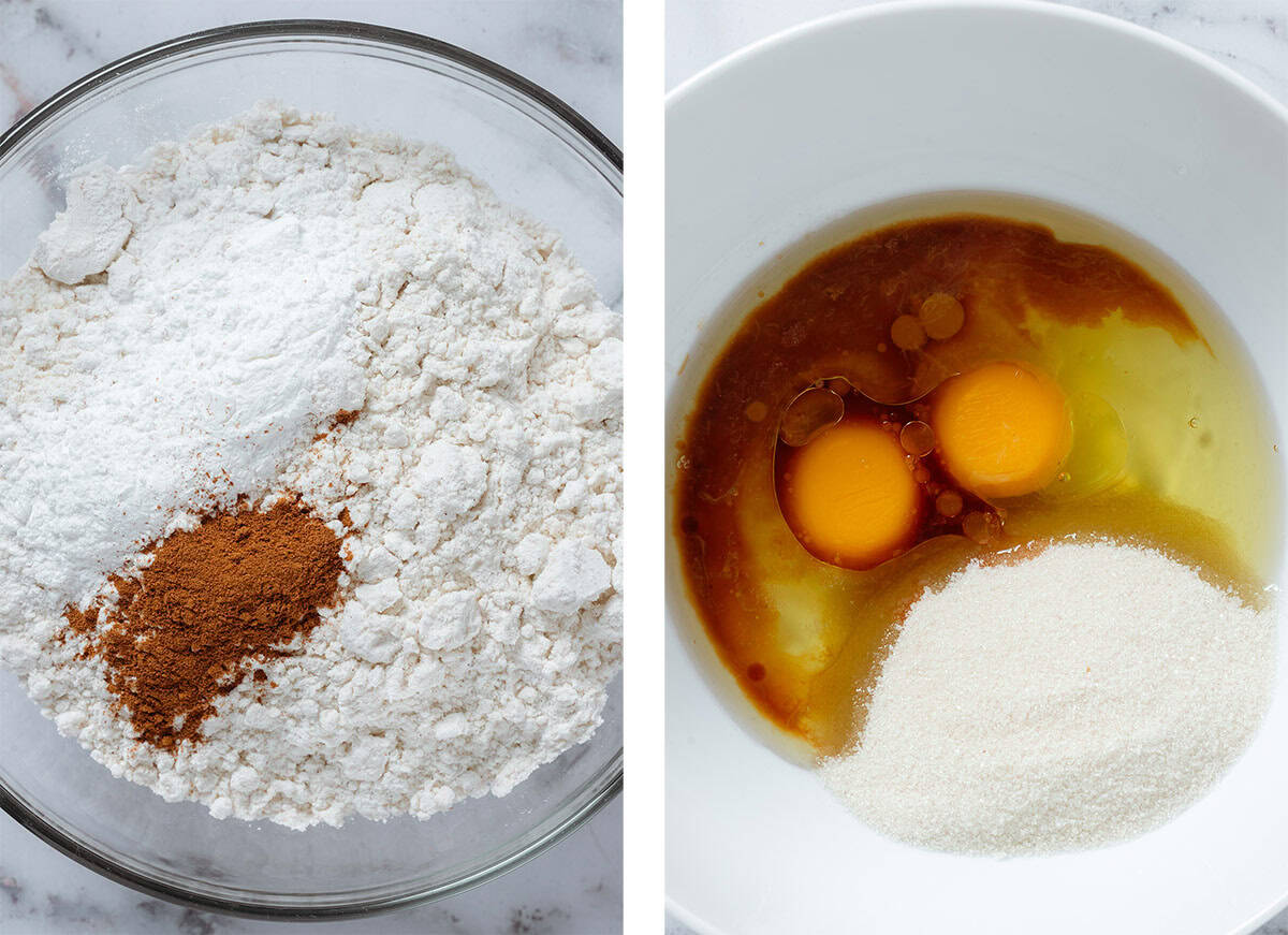 Flour, baking powder, and cinnamon in a glass bowl on the left and sugar, eggs, and other liquid ingredients in a white bowl on the right.