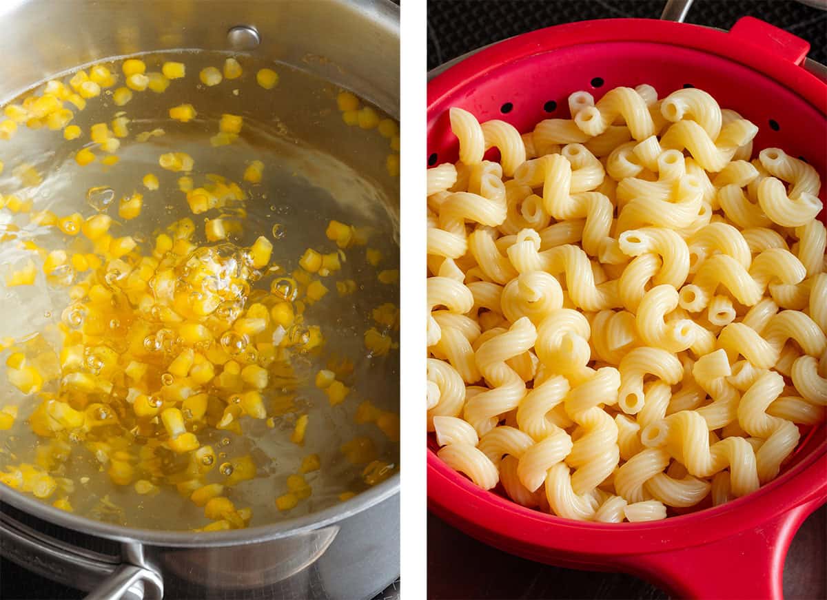 Corn in a large pot of boiling water and cooked pasta on the right in a red strainer.