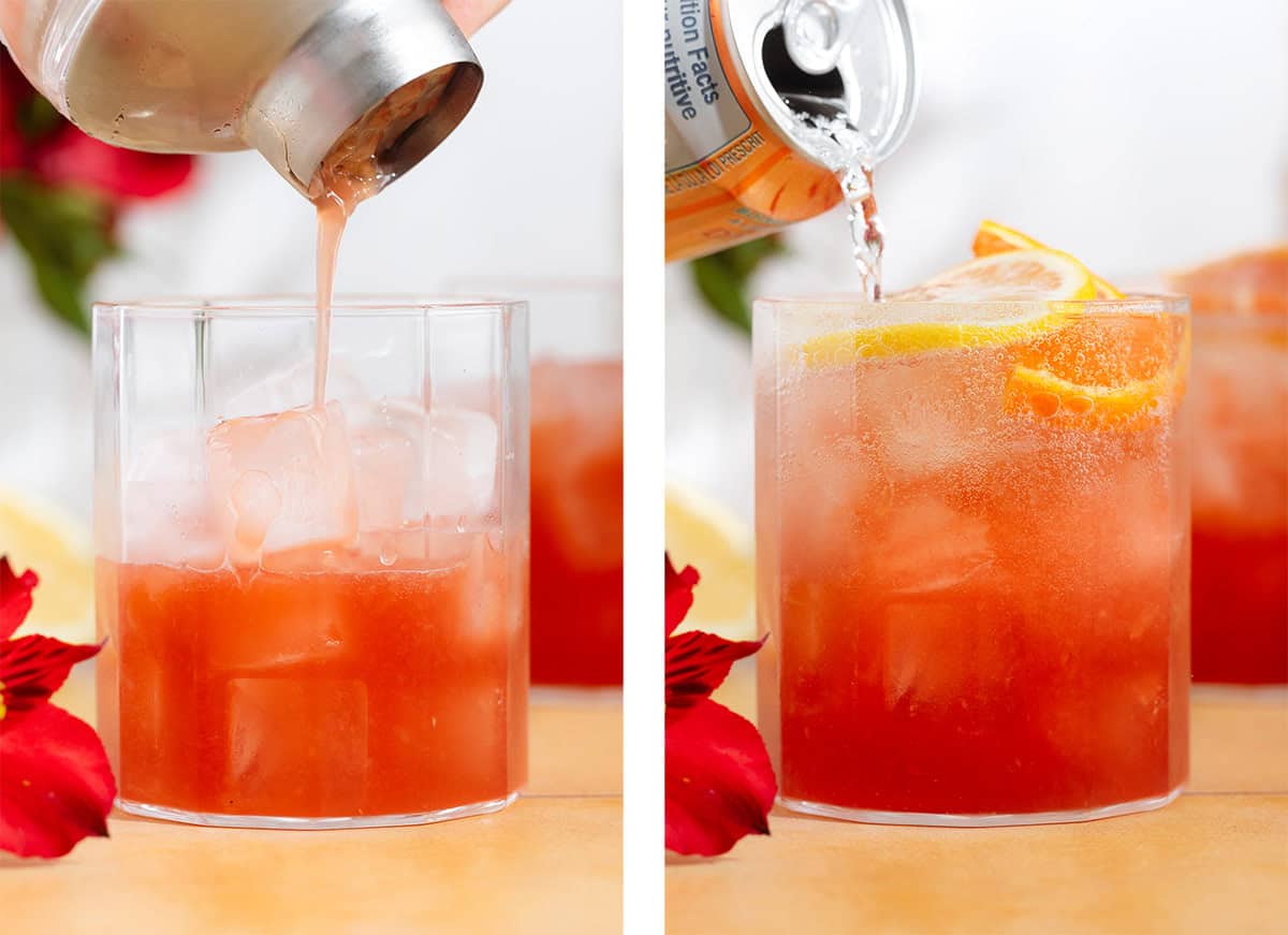 Bright red hibiscus mocktail being strained into a short glass over ice and topped with sparkling water.