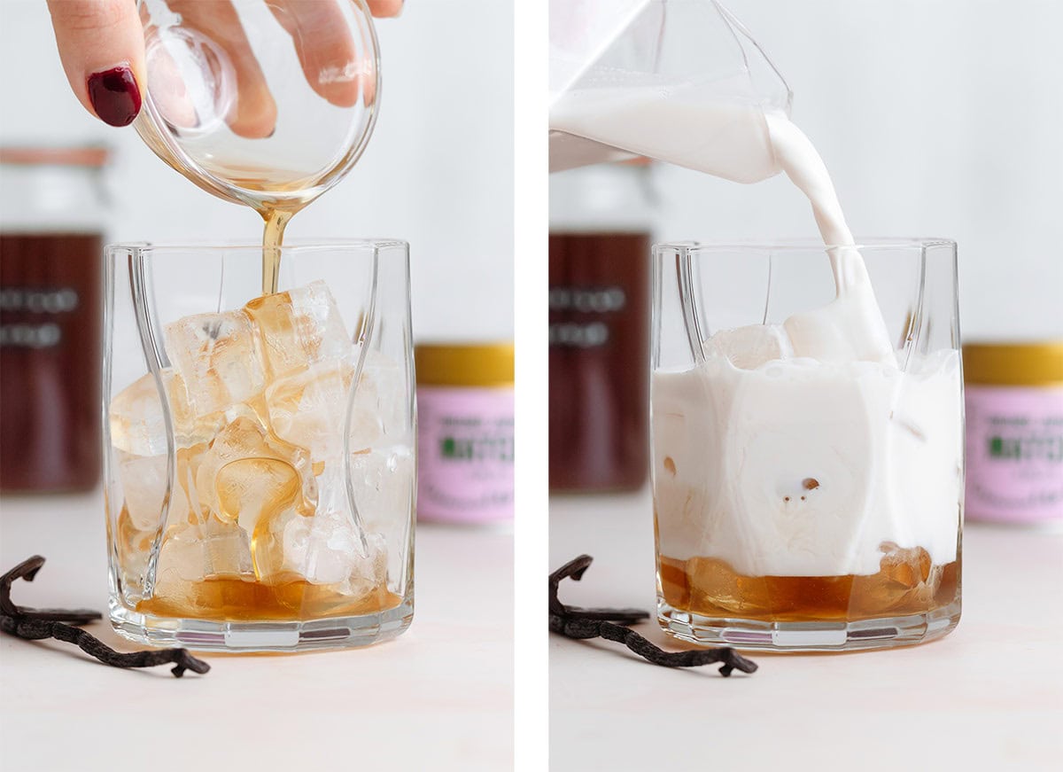Vanilla syrup and milk being poured into a short glass over ice.