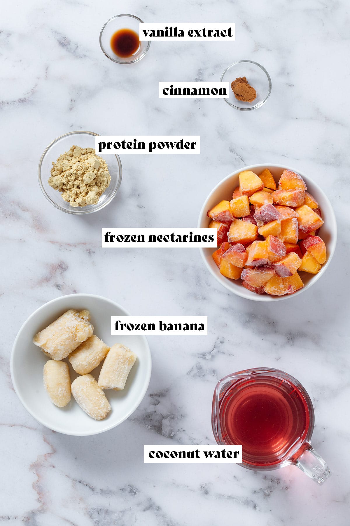 Frozen diced nectarines, frozen banana, coconut water, protein powder, vanilla, and cinnamon in small bowls with text overlay.