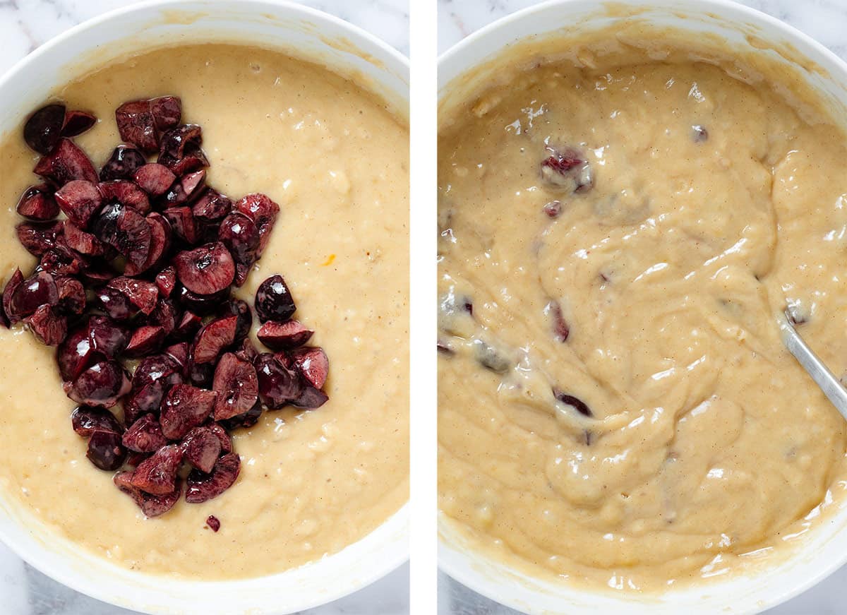 Cherries being added into a large bowl with batter before and after folding them in.