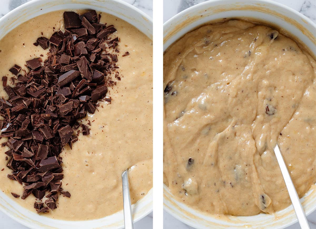 Chopped dark chocolate being added into banana bread batter in a large white bowl and folded in.