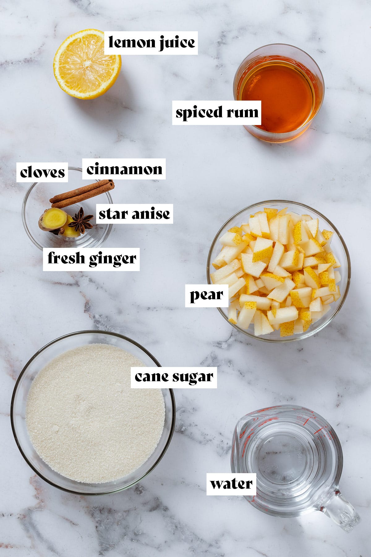 Ingredients like chopped pear, cane sugar, spiced rum, and spices in glass bowls with text overlay.