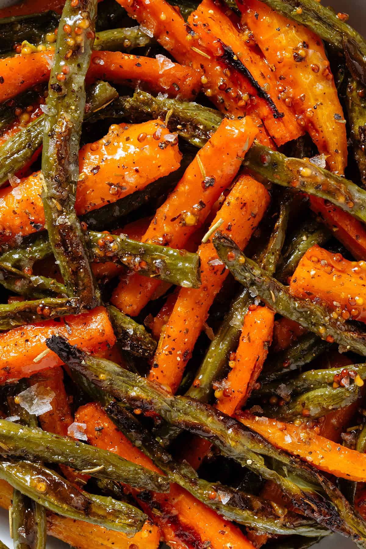Roasted carrots and green beans with whole mustard vinaigrette and flaky sea salt.