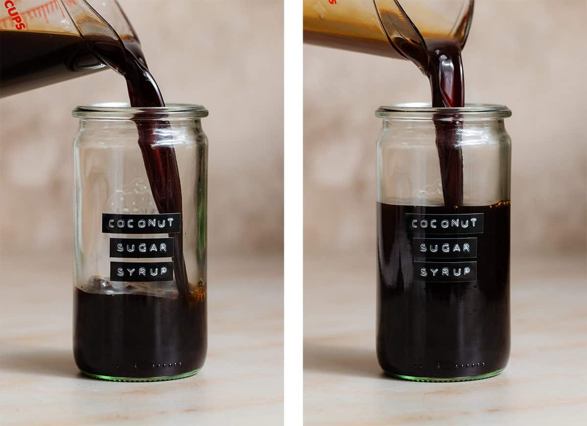 Coconut sugar syrup being poured into a tall glass jar with an embossed label on a beige background.