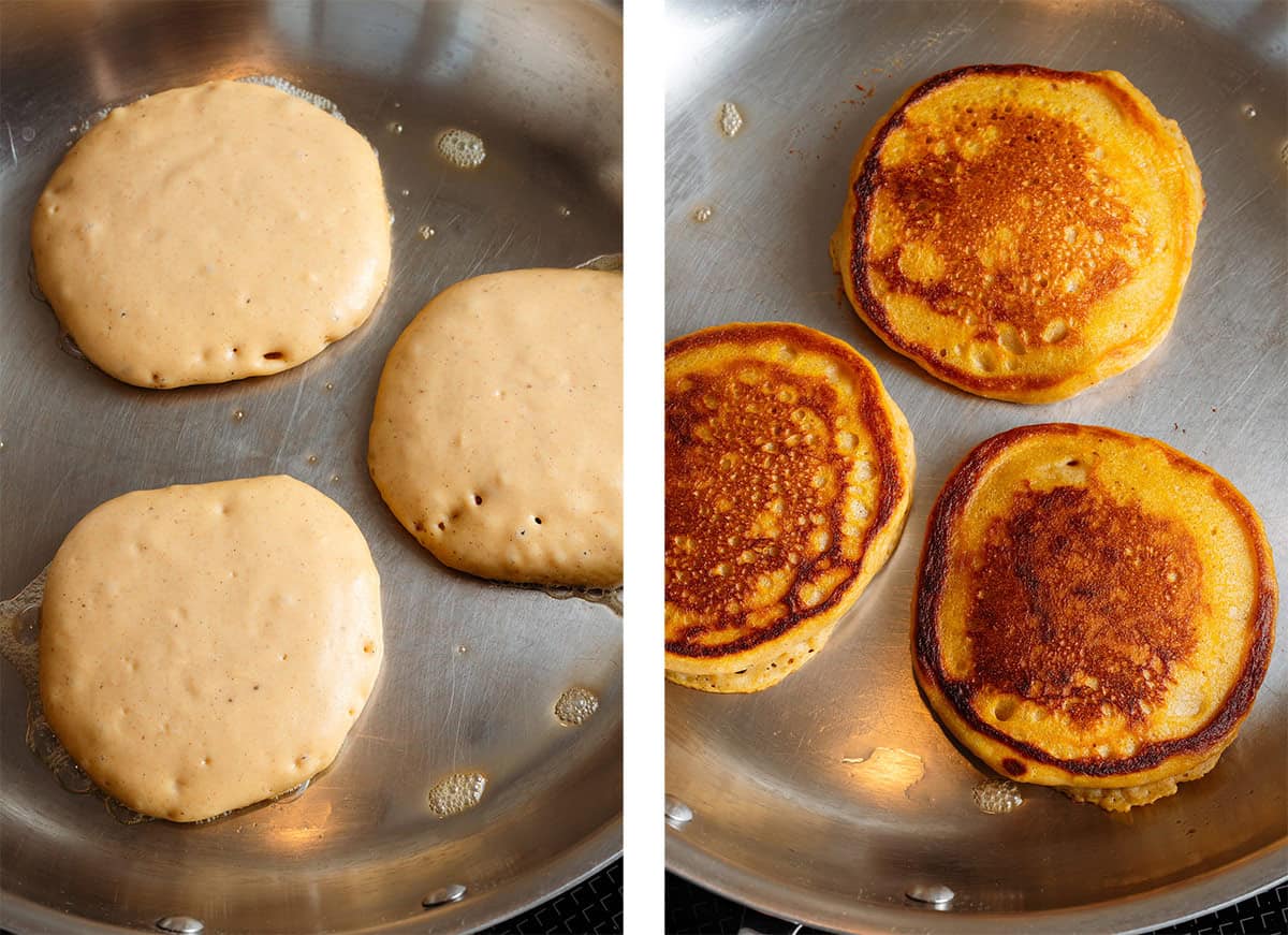 Three sweet potato pancakes cooking in a stainless steel pan in butter.