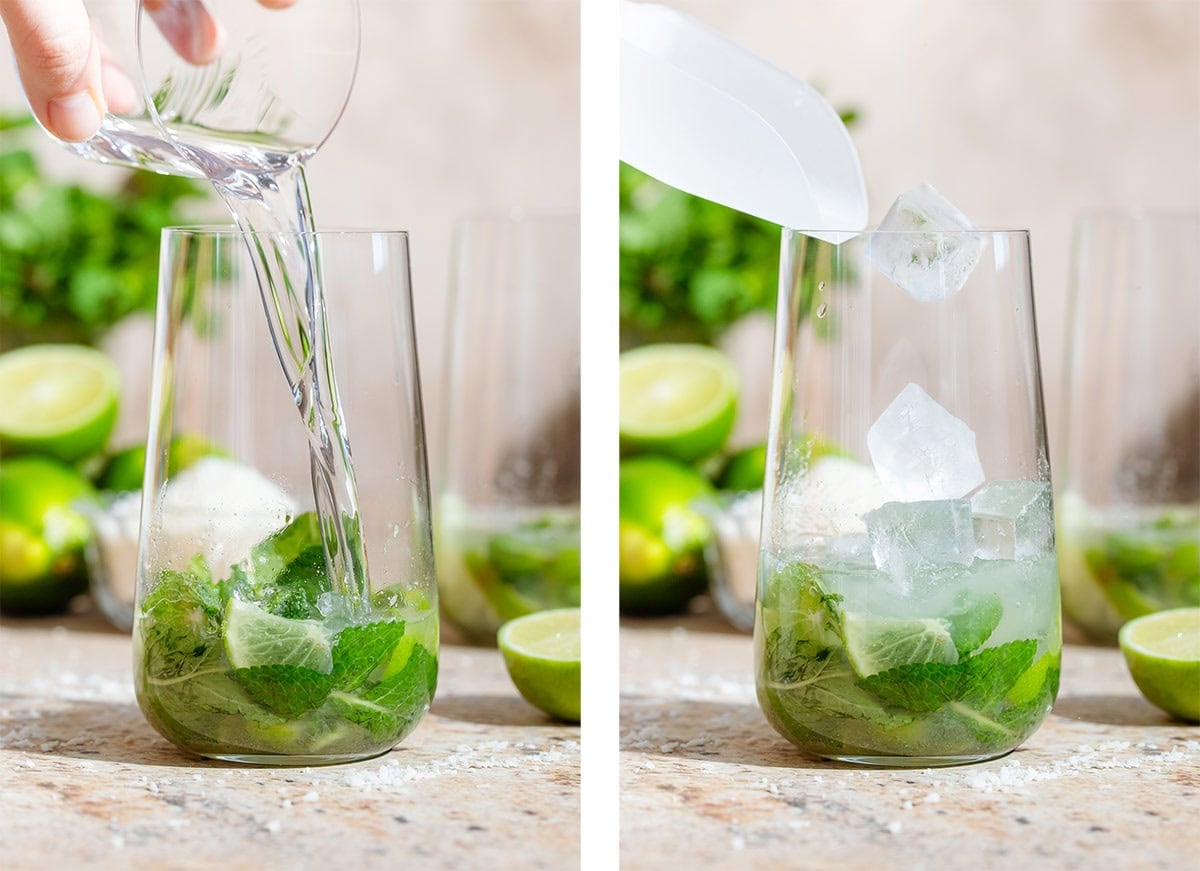 White rum and ice being added to a tall glass with chopped lime and fresh mint.