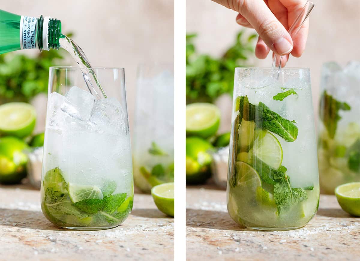 A tall glass with chopped limes, fresh mint, rum, and ice being topped with with sparkling water on the left and stirred with a glass straw on the right.