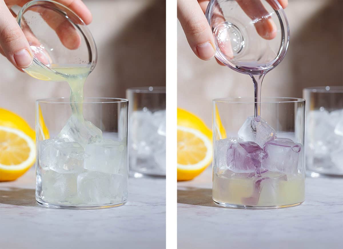 Lemon juice and lavender syrup being poured over ice in a short glass.