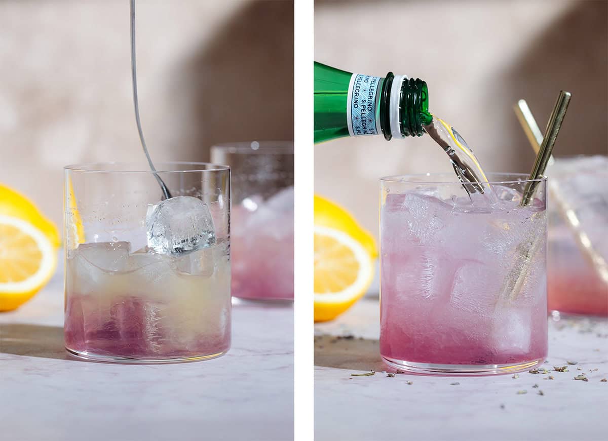A light pink lavender mocktail in a short glass being stirred with a spoon on the left and topped up with sparkling water on the right.