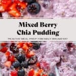 Light purple chia pudding with mixed berries in a low white bowl topped with fresh blueberries, cherries, and chopped strawberries with a spoon in the bowl.
