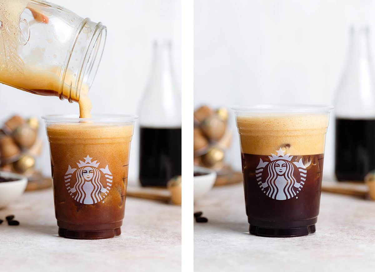 Frothy shaken espresso with ice being poured into a plastic Starbucks cup.