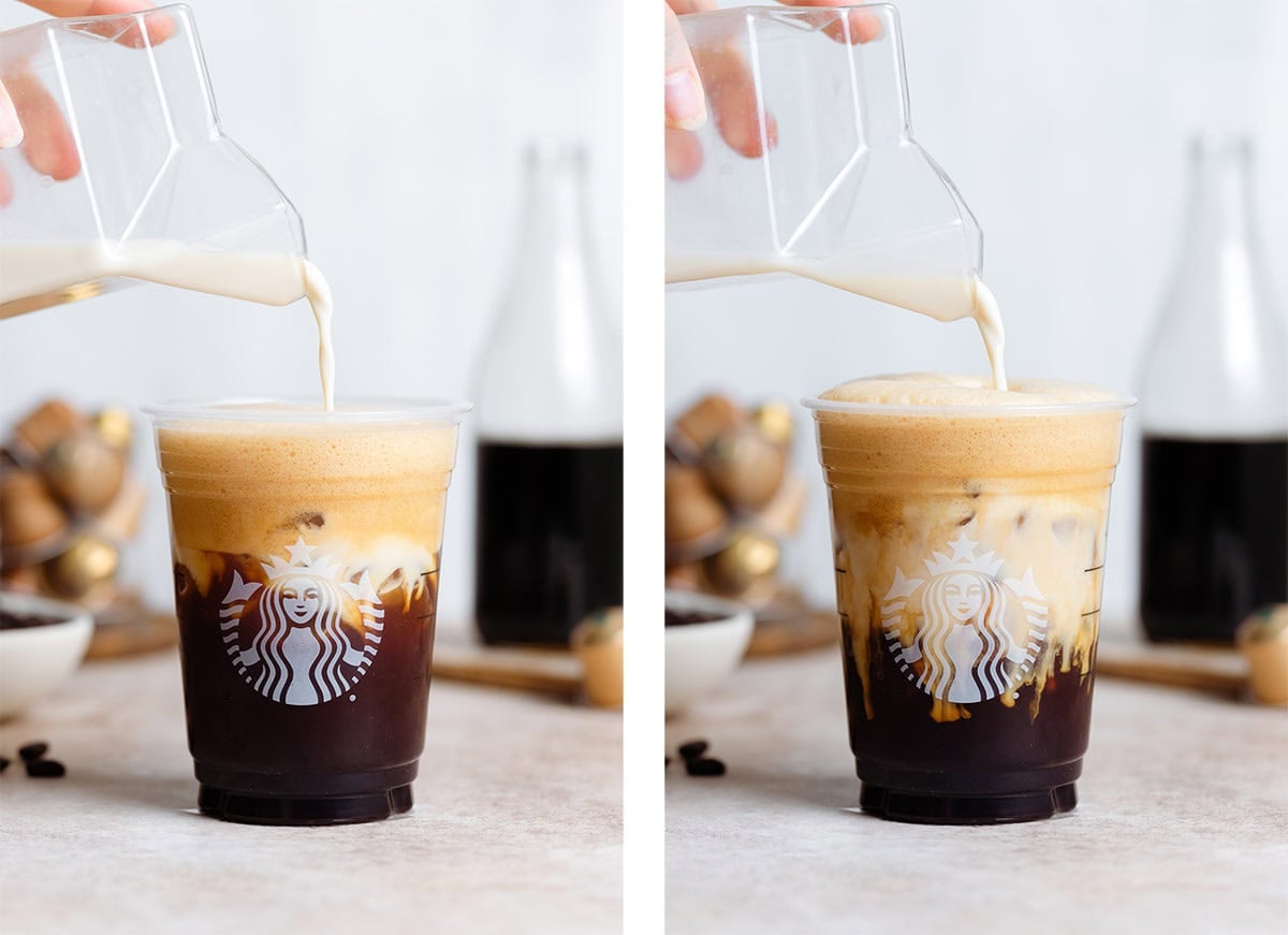 Oat milk being slowly poured into a plastic Starbucks cup with frothy shaken espresso with ice creating a layered effect.