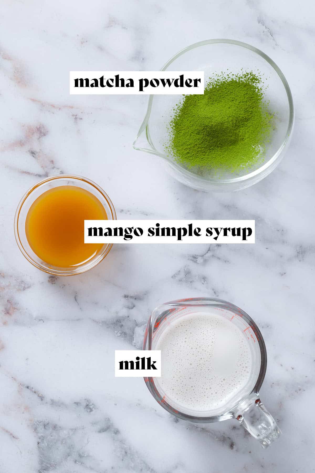 Matcha powder, mango syrup, and milk in small glass bowls with text overlay.