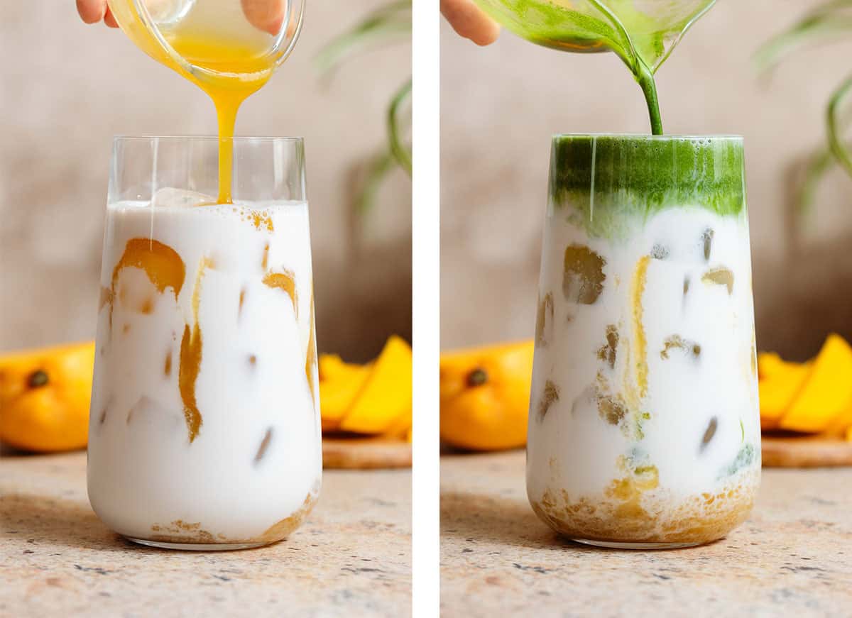 Mango syrup and whisked matcha being poured over ice and milk into a tall glass.