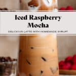 An iced raspberry mocha in a tall glass showing frothy milk creating a layered effect on top and it being stirred on the bottom.