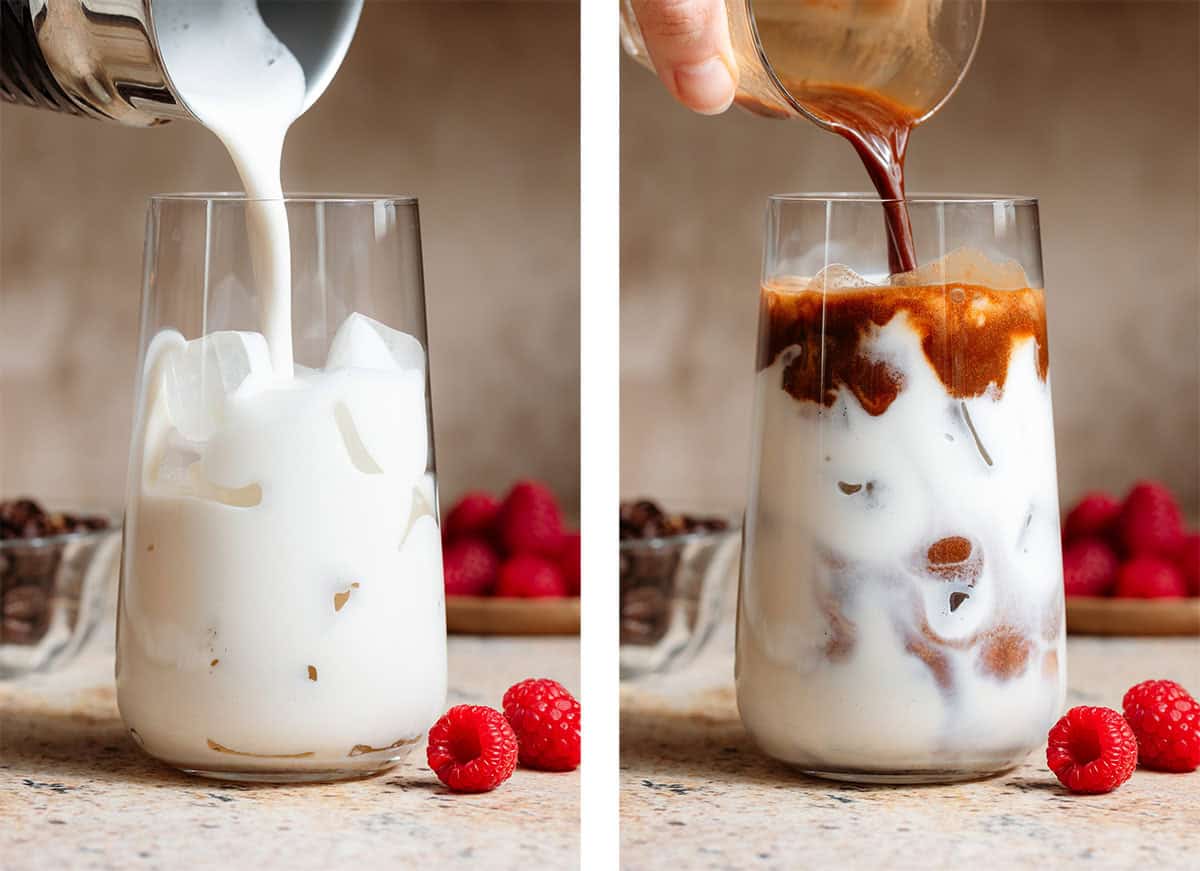 Milk and espresso being poured over ice into a tall glass.