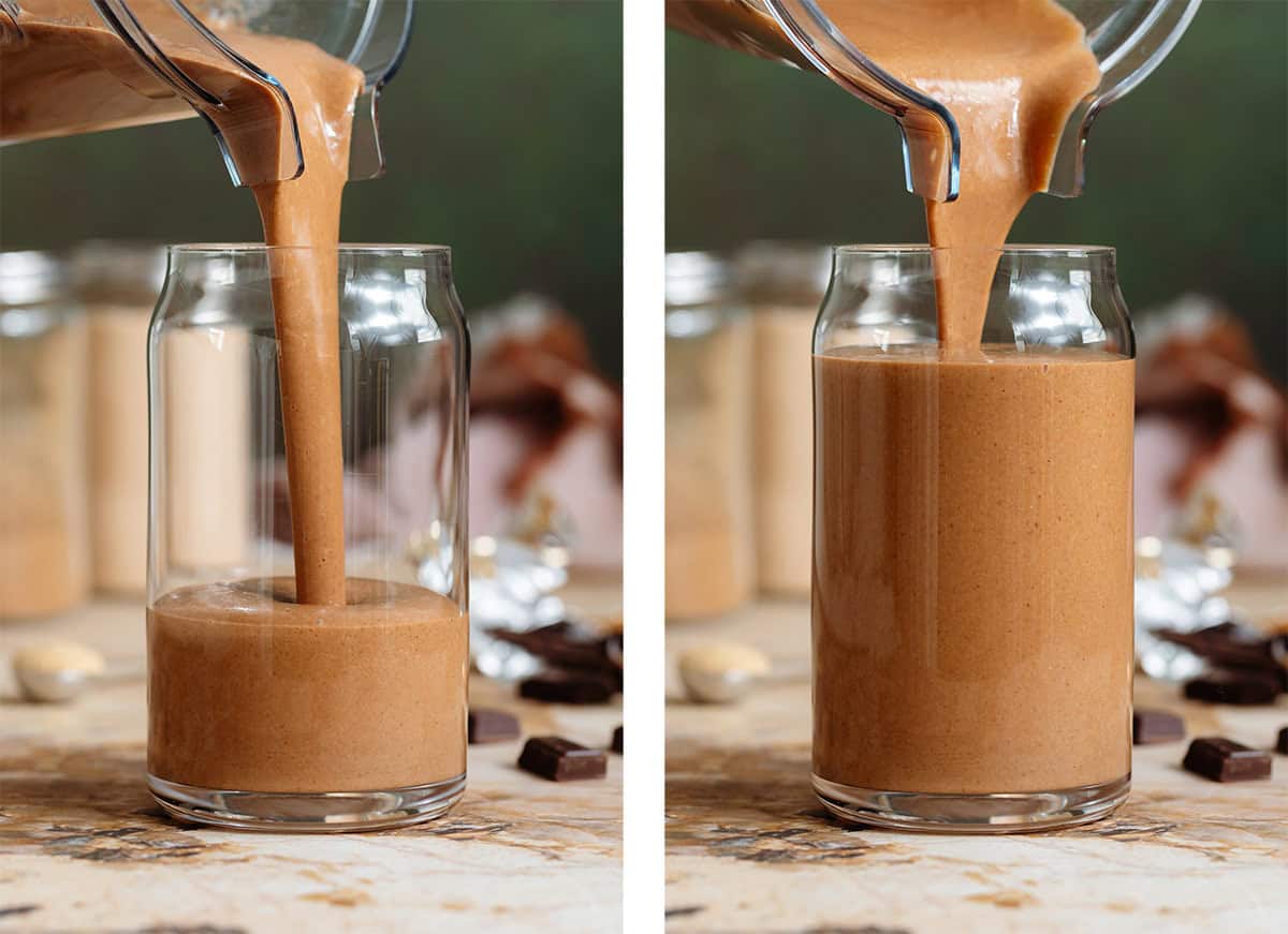 Creamy chocolate smoothie being poured into a tall glass shaped like a soda can from a blender container.