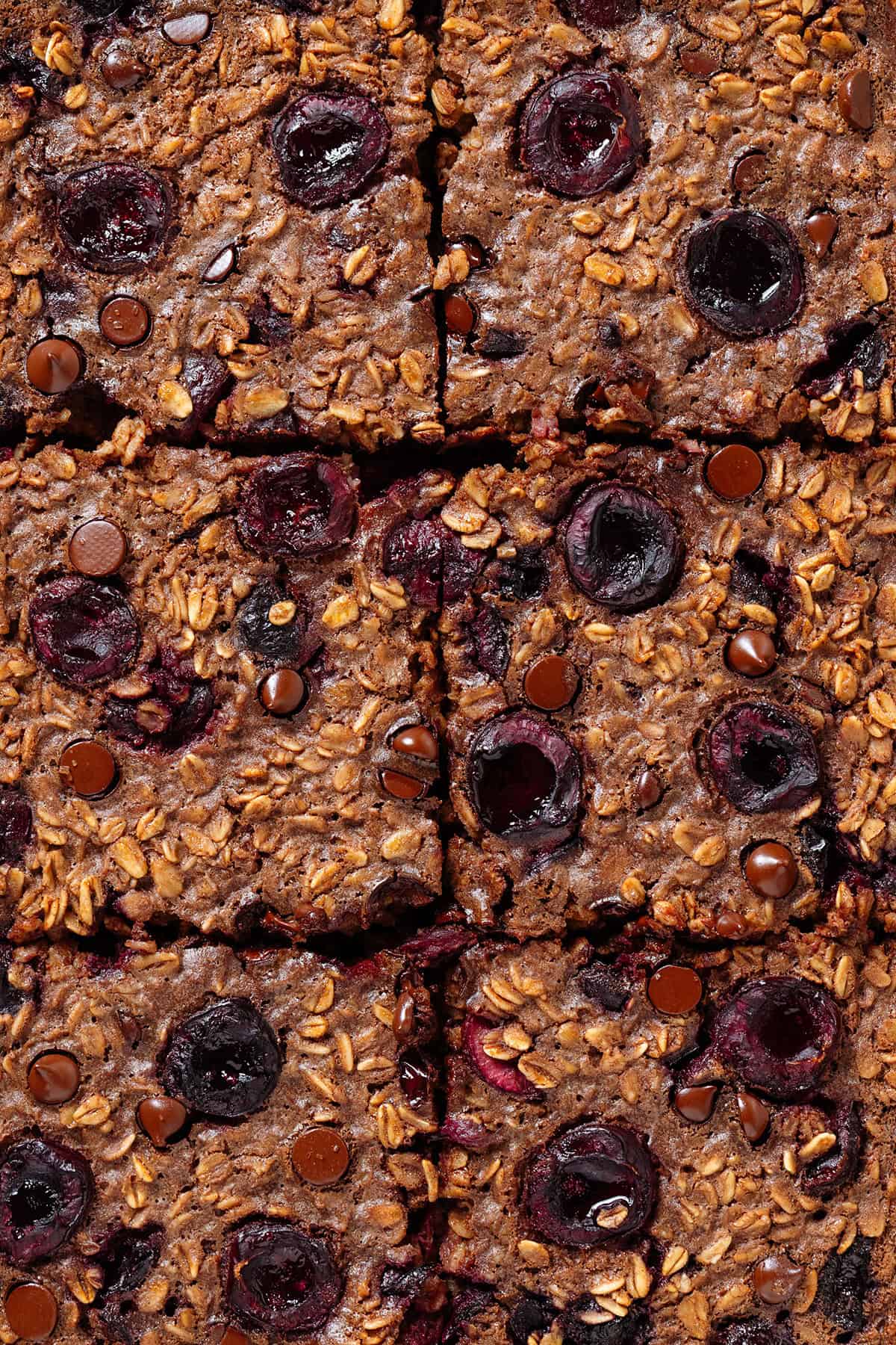 Chocolate and cherry baked oatmeal sliced into 6 squares before being taken out of the baking pan.